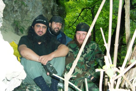 Moscow, russia, july 26, 2002, khattab's right-hand man isayev, aka the 'elsi the red', achimez gochiyayev, khattab (r-l) seen in the photo made public by the federal secirity service