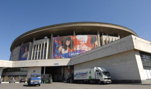 Moscow, russia, april 23, 2009, a huge billboard bearing the logo of 2009 eurovision song contest is installed on the outside wall of olimpiysky sports complex in central moscow.