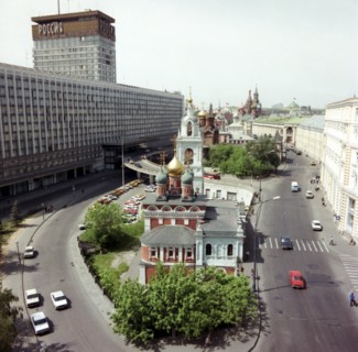 Central part of zarjadie-varvarka street, moscow, russia, hotel 'russia' ('rossiya') on the left, in the foreground, george church on the pskov hill (17th century).