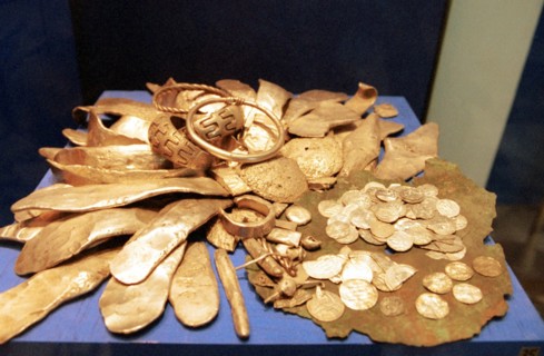 Coins and othr recovered objects from a hidden treasure of the 12th century, russia, 2001.