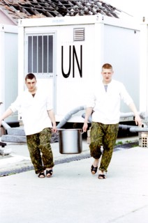 Russian paratroopers carrying a saucepan with soup from the uno, croatia, 1997, the russian peace-keeping batallion in klisa will be the last united nations forces to be withdrawn from croatia.