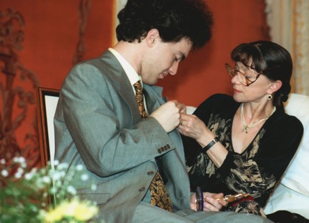 Moscow, russia 6/26/97: famous ballet dancer yekaterina maximova /right/ attaches a badge of russian independent 'triumph' prize to prominent russian pianist yevgeny kisin who lives now in the united ...