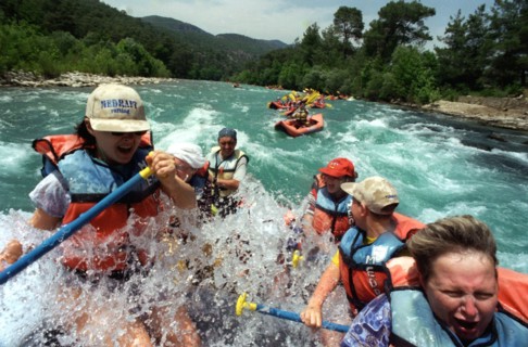 Russian tourists enjoying white-water rafting near antalya in turkey which in recent years has become a popular vacation destination.