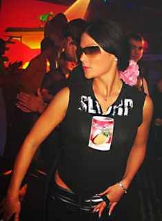 Fashionable young latvian woman dancing at nautilus a popular night club in riga's old city, latvia, 2003.