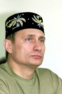 Kazan, tatarstan, russia, june 24 2000, russian president vladimir putin wearing a tatar embroidered skull-cap on his head seen attending an open-air holiday events organized outside kazan, sabantui h...