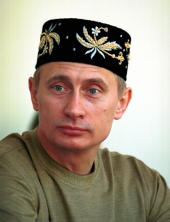 Kazan, tatarstan, russia, june 24 2000, russian president vladimir putin wearing a tatar embroidered skull-cap on his head seen attending an open-air holiday events organized outside kazan, sabantui h...