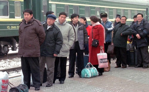 Russia, february 6, 2003: a regular group of chinese tourists has arrived at the station of grodekovo, russia's maritime territory