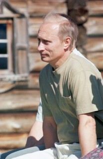 President putin visits kihzi island in karelia as part of his vacation tot he region 2001.