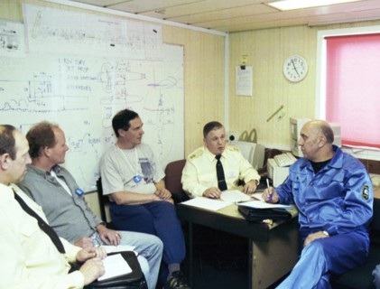 Barents sea, july 19 2001, head of diving work sean popple (r) and head of the team of russian divers gennady verich (r) aboard the mayo ship, located in the barents sea over wrecked sub 'kursk', russ...