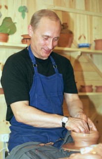 Karelia, russia, august 21 2001, president vladimir putin tries his hand at pottery while visiting the ethnographic village of verkhniye mondrogi on his way to the kizhi island,    21,08,2001 .