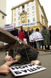 Moscow, russia, march 22 2002: participants of a rally in front of the american embassy protesting import of chicken leg quarters from the u,s,a, about a dozen youngsters took part in the rally, the p...