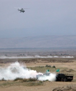 Caspian war game episode, dagestan, russia, august 11, helicopters attacking simulated enemy positions (in pic), an episode of war game within the framework of the exercises of the caspian flotilla.
