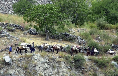 Russian border guards of kalaikhumb command, tajikistan, october 14, 2002, dwellers of nusai settlement (in pic) came close to the border seeking shelter from intensified military operations on afghan...