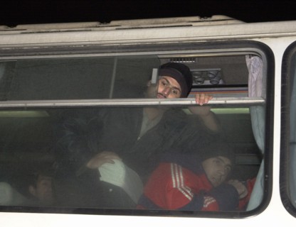Moscow, russia, november 15 2002: tajik illegal immigrants (in pic) in a bus prior to their departure for chkalovsky airport for further deportation, the people's courts of khimki and podolsk district...