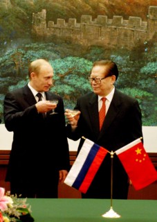Beijing, china, december 2 2002: president of russia vladimir putin (left) and chairman of the people's republic of china jiang zemin(right) toast after the talks at the national congress centre, mond...
