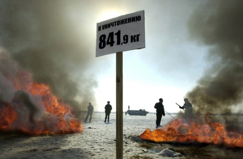 Tajikistan, december 6 2002: men of the moskovsky border detachment burning up packets containing the confiscated drugs with a total weight of 841,9 kilograms, on friday, the drugs were confiscated in...