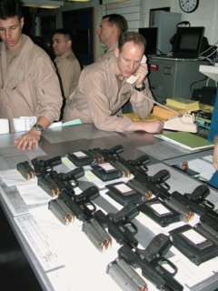 Mediterranean sea, uss theodore roosevelt, march 22, 2003, servicemen pictured prior to the briefing for pilots, held here aboard the aircraft carrier theodore roosevelt before the beginning of the mi...