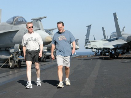 Uss theodore roosevelt aircraft carrier, mediterranean sea, march 25, servicemen on a stroll (in pic) on the flight deck of uss theodore roosevelt lying in the eastern part of the mediterranean sea.