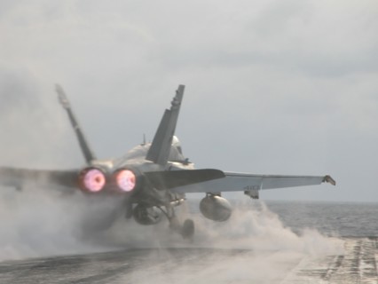 Uss 'theodore roosevelt' aircraft carrier, mediterranean sea, march 26 2003, a hornet fa-18 fighter pictured taking off from the flying-on deck of the uss 'theodore roosevelt' aircraft carrier for an ...
