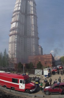 Caption: tas 17, moscow, russia, may 12, 2003, firemen pictured extinguishing the fire that broke out in a garage at the territory of the 'alye papusa' dwelling house ,on monday, (photo itar-tass/ lyu...