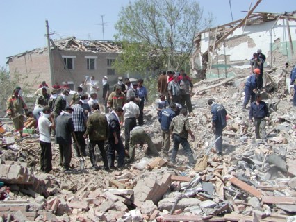 Chechnya, russia, may 12, 2003, people pictured clearing the debris in the village of znamenskoye where a powerful explosion ruined the buildings that housed the district administration ,on monday, ma...