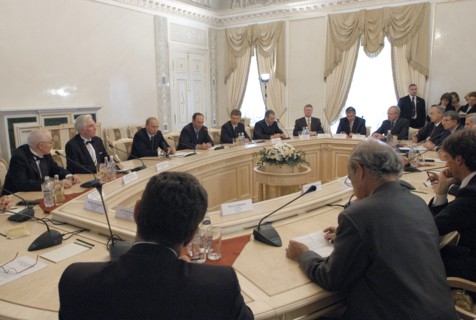 Russian president vladimir putin (centre in the background) seen presiding at a conference of laureates of the global energy international prize and top managers of russian energy corporations, gazpro...