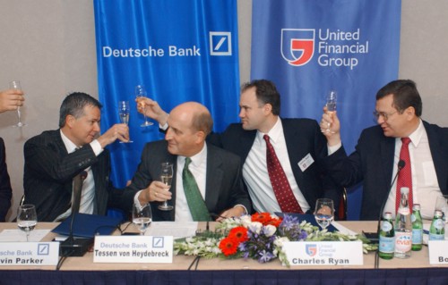 (l-r) kevin parker, tessen von heydebreck (deutsch bank ag) charles rhine and boris fedorov (fyodorov) (united financial group) celebrating signing business cooperation agreement in hotel 'balchug-kem...
