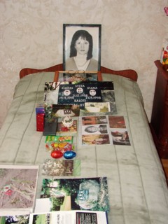 The portrait, bed and photographs of svetlana - the wife of a construction engineer vitaly kaloyev, who is suspected of the murder of a swiss air traffic controller peter nielsen, north ossetia, russi...