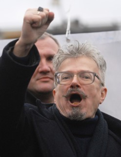 National bolshevik party (nbp) leader eduard limonov raises his fist as he shouts during an opposition protest rally dubbed the 'march of those who disagree' in triumfalnaya square, december 18, 2006,...