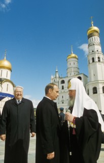 Russian president vladimir putin in cathedral sq inside the kremlin on the day of his inauguration, may 7, 2000, with him are all russia patriarch alexi ll and boris yeltsin.