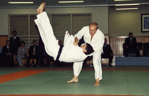 Russian president vladimir putin throwing an opponent at a judo demonstration during his state visit to japan in september 2000, tokyo.