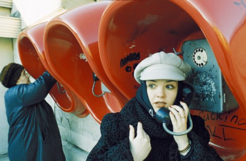 Fashionable young woman at the public phones in lipetsk which have been free since 1996, april 2001.