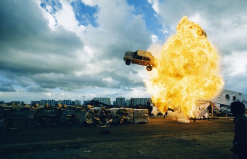 A car flying through a ball of fire at the 4th international stunt driving festival in khodynskoye field, moscow, may 2001.
