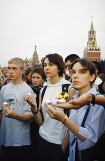 Young demonstrators holding a candle light vigil in red square in moscow to potest the import of nuclear waste into russia, july 2001.