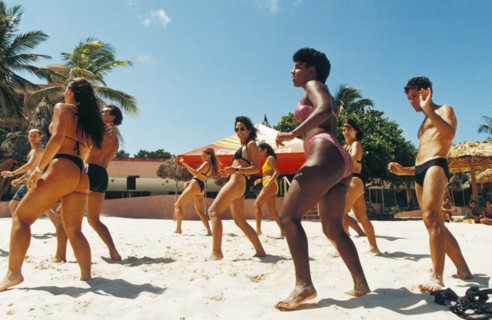 A dance class being held on the beach at a resort on varadero beach, cuba.