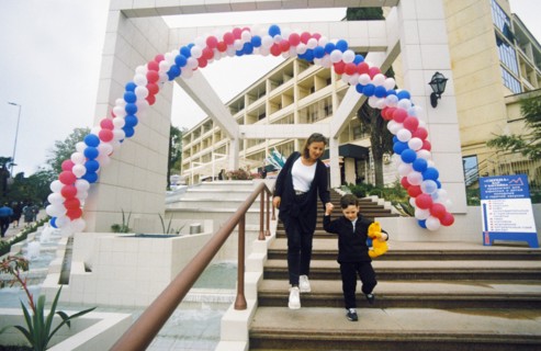 A mother and her son leaving the hotel kavkaz in sochi, krasnodar region, russia.