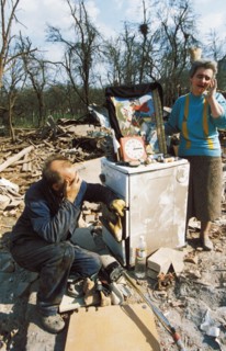 A serb couple sitting in the ruins of their home in cacak (170 km from belgrade) after a nato air strike, yugoslavia, april 1999.