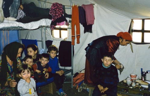 A chechen family in a tent at the 'sputnik' refugee settlement in ingushetia, november 1999.