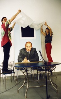 Artists victoria timofeyeva and dmitry vrubel unveiling their joint project, a painting of president putin with k, malevich's 'black square', july 2002.