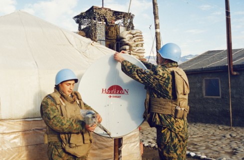 Russian un peacekeepers in abkhazia adjusting a satellite dish at their camp during the conflict between georgia and abkhazia, february 2003.