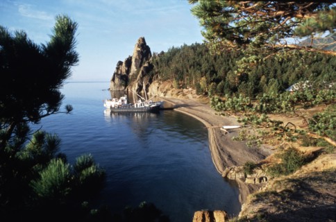 Fishing boats along the shore of lake baikal in the irkutsk region of siberia, russia.