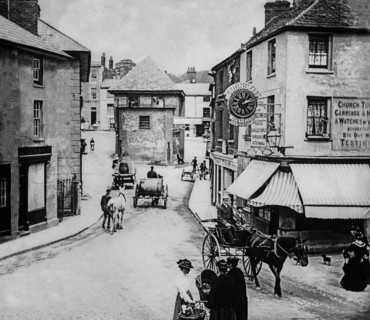 A clockmaker shop and mechanical clock depicted from a magic lantern slide circa 1900; Faringdon