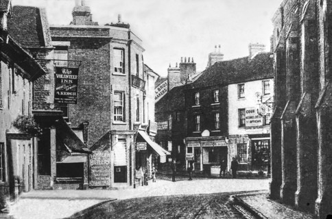 Faringdon village street scene depicting the Volunteer Inn and various shops