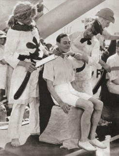 The Duke of York suffers the line-crossing ceremony aboard The Renown in 1927