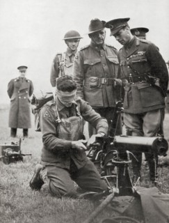 King George VI watching a blindfolded Australian soldier assemble a machine gun