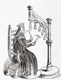 A king using small hammers to play hand-bells which were suspended from a wooden stand
