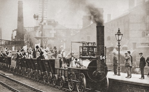 George Stephenson's railway engine making the journey from Stockton to Darlington in 1925 to mark its hundred years anniversary of the first journey in 1825.  From These Tremendous Years