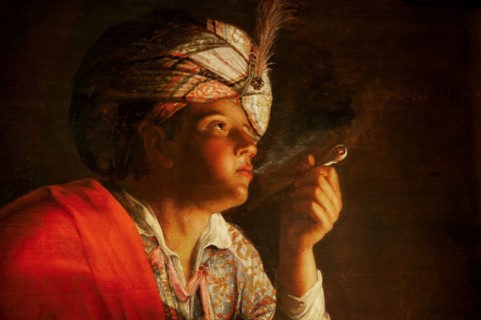 Young man smoking a pipe