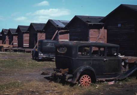 Negro migratory workers by a shack, Belle Glade,