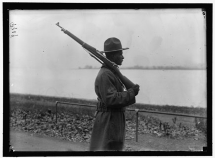 African American soldier drills at shoulder arms